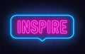 Inspire neon sign in the speech bubble on brick wall background.