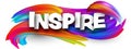 Inspire paper word sign with colorful spectrum paint brush strokes over white