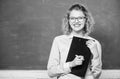 Inspire. teacher with document folder. girl teacher at school lesson. happy student in glasses at blackboard. report Royalty Free Stock Photo