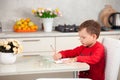 Inspired by the boy draws a picture on the paper at the table