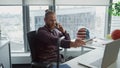 Inspired designer calling smartphone modern office closeup. Man using laptop Royalty Free Stock Photo