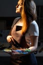 inspired female artist enjoying painting creative