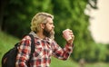 Inspired handsome hipster. Drink tea or coffee. Man with cup outdoors. Man outdoors with cup of coffee. Drinking hot