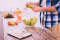 Inspired man preparing a dish with a salad