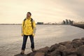 Inspired man on sea beach in reykjavik, iceland. Man traveler smile and looking in future on sea shore. freedom sence Royalty Free Stock Photo