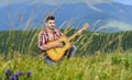 Inspired musician play rock ballad. Compose melody. Inspiring environment. Acoustic music. Man with guitar on top of Royalty Free Stock Photo