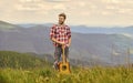 Inspired musician. Summer music festival outdoors. Playing music. Silence of mountains and sound of guitar strings