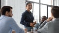 Confident indian businesswoman convincing thoughtful multiethnic business partners on negotiations