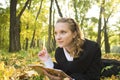 Inspired teenager girl in autumn park Royalty Free Stock Photo