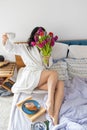 Inspired young asian woman enjoying romantic breakfast in bed, happy life, relaxation Royalty Free Stock Photo