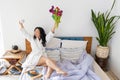 Inspired young asian woman enjoying romantic breakfast in bed, happy life, relaxation Royalty Free Stock Photo