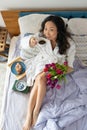 young asian woman enjoying romantic breakfast in bed, happy life, relaxation Royalty Free Stock Photo