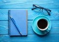 Inspiring Blue Workspace A TopDown View of a Productive and Stylish Desk Featuring a Notepad Pen Glasses and Royalty Free Stock Photo
