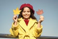 Inspiring fall. Ideas for autumn leisure. Little girl adore autumn season. Kid hold maple leaves. Small girl wear fall