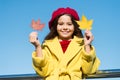 Inspiring fall. Ideas for autumn leisure. Little girl adore autumn season. Kid hold maple leaves. Small girl wear fall