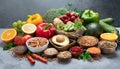 Variety of fruits, vegetables, seeds, superfoods and grains on gray background