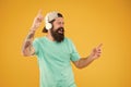 Inspiring song. Music library. Feel rhythm. Bearded guy enjoy music. Equalizer player settings. Lifestyle music fan. Man Royalty Free Stock Photo