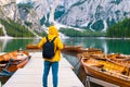 Inspiring traveler visited popular lake Braies with cinematic beautiful mountains in Dolomites Alps