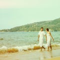 Instagram colorized vintage couple on beach portrait