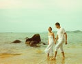 Instagram colorized vintage couple on beach portrait