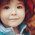 instagram image closeup up of little girl with stunning brown eyes