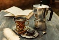 Instagram looking picture of cup of coffee and moka pot Royalty Free Stock Photo