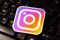 Instagram new logo label laying on a PC, computer keyboard keys, closeup. Instagram social media web app service, company sign Royalty Free Stock Photo