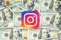 Instagram new logo printed on paper and placed on money background