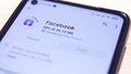 Install Facebook mobile app for smartphones. Close up of Facebook icon on a mobile phone screen. Installing android applications.