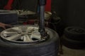 Install a new car wheel on tyre remover machine Royalty Free Stock Photo
