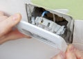 Install wall light switch Insert into electrical box Royalty Free Stock Photo