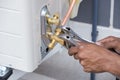 Installation of air conditioner, worker connects copper pipe Royalty Free Stock Photo