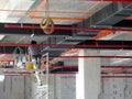 Installation of airconditioner ducting and chiller pipes system and hung it at the concrete slab.