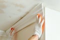 Installation of ceiling moldings. Royalty Free Stock Photo