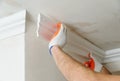 Installation of ceiling moldings. Royalty Free Stock Photo