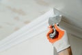 Installation of ceiling moldings. Royalty Free Stock Photo