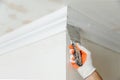Installation of ceiling moldings. Royalty Free Stock Photo