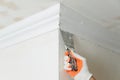 Installation of ceiling moldings. Royalty Free Stock Photo