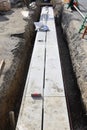 Installation construction of street gutter on the road Royalty Free Stock Photo
