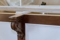 Installation of a corbels on island in a new kitchen for granite countertop Royalty Free Stock Photo