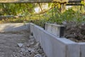 Installation of curbs. laying curb stones using concrete. Selective focus