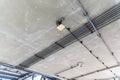 Installation of electrical wiring on the ceiling. Electrical cable system installation