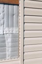 Installation on facade panels beige vinyl siding Royalty Free Stock Photo