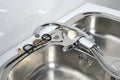 Installation of a faucet in a kitchen sink Royalty Free Stock Photo