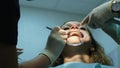 Installation and fixing of metal braces. Visit to the dentist orthodontist, correction of malocclusion, treatment teeth