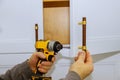 Master drills the cabinet door in the cabinet door