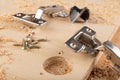 Installation of furniture hinges in chipboard. Small carpentry work in the workshop Royalty Free Stock Photo
