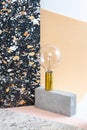 Installation of geometric shapes and lamps on a stylish modern background with a Terrazzo pattern Royalty Free Stock Photo
