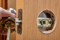 Installation of a handle with a latch lock for an interior door