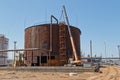 Repair work on replacement of lower belts of old rusty tank for Royalty Free Stock Photo